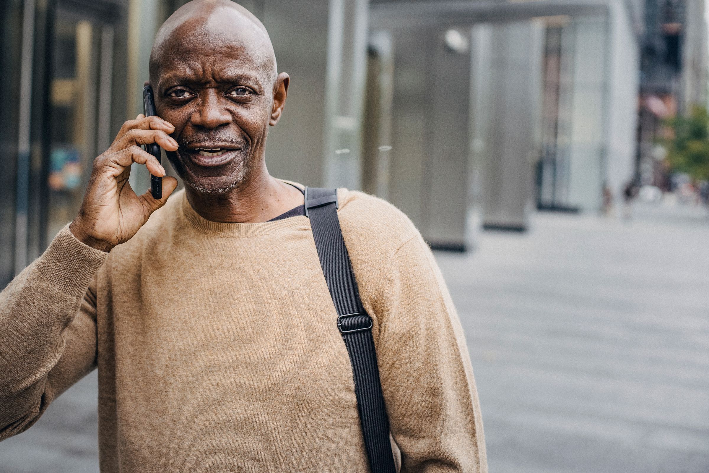A man on a phone call in the street